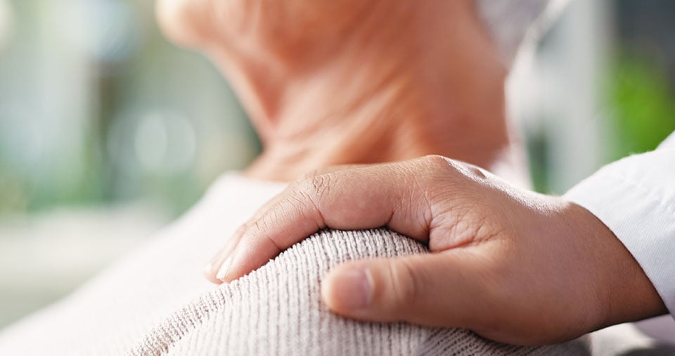 doctor-placing-hand-on-shoulder